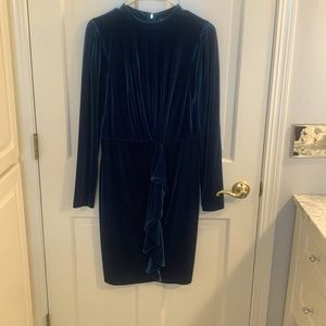 Woman’s teal velour dress
